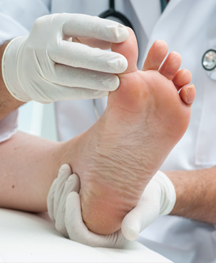 Photo of a foot holding by a doctor